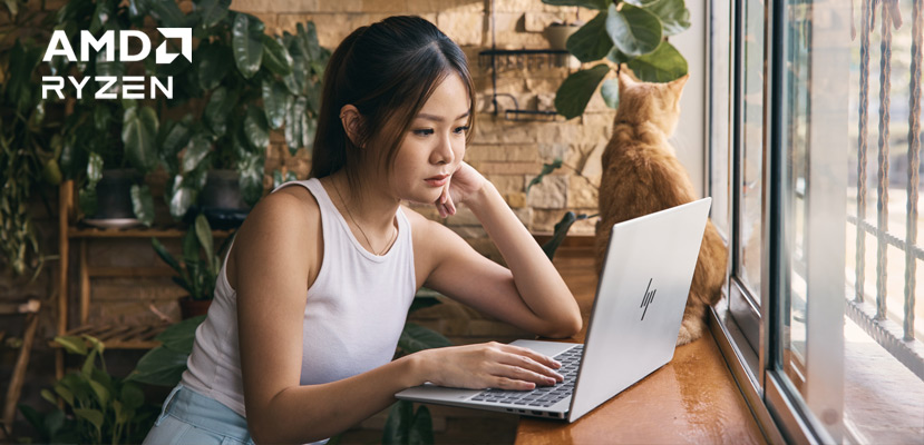 A girl is working with an AMD laptop