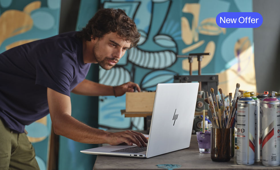 An artist man enjoying his Subscribed laptop