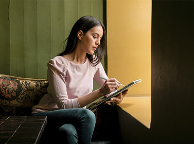 image of a girl working with a laptop