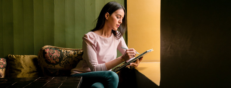 image of a girl working with a laptop