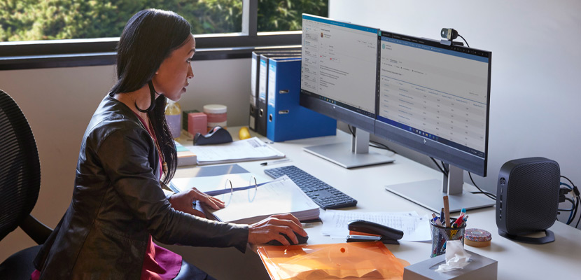 woman in office working with thin clients